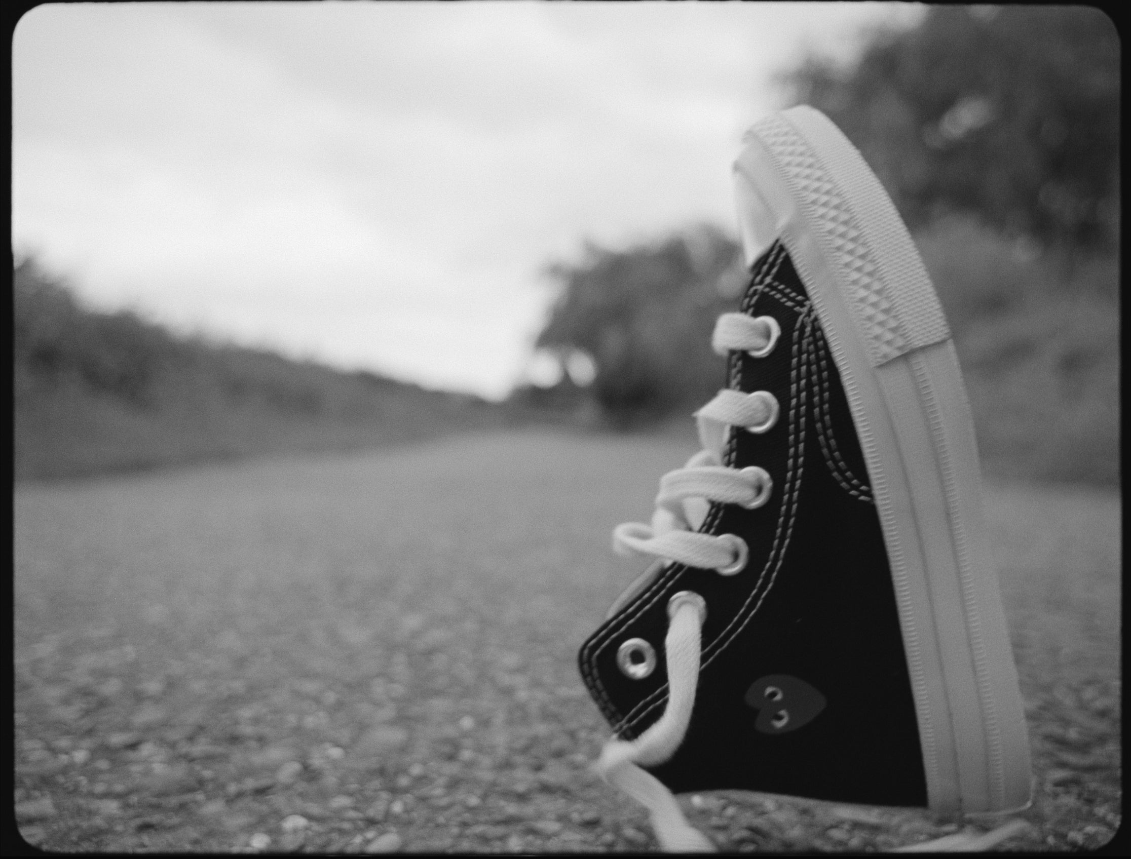 Fashion model wearing a Play Comme des Garçons x Converse outfit